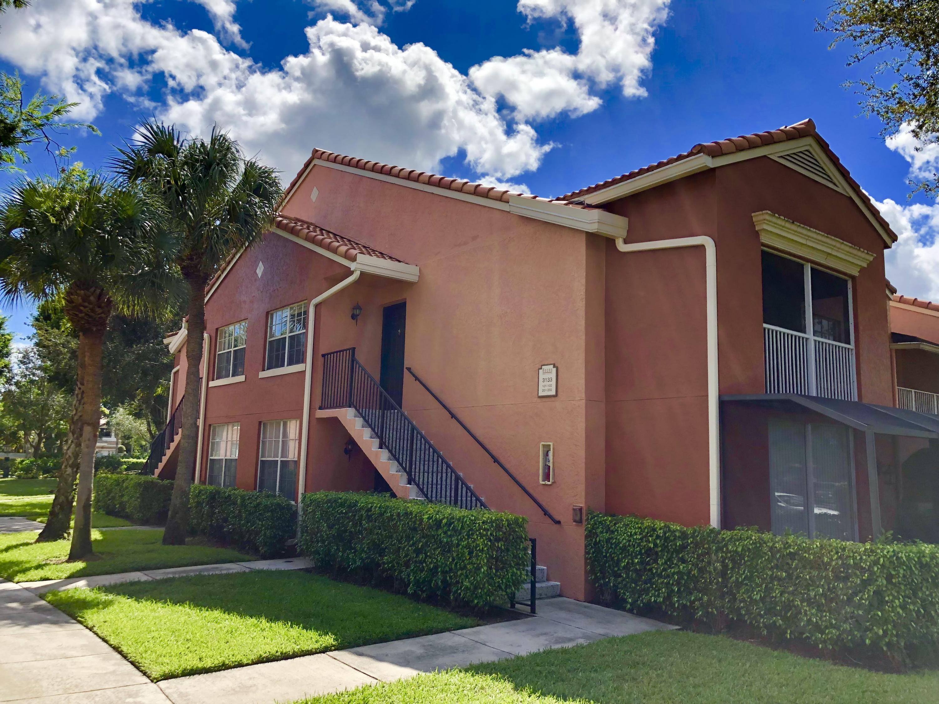 3133 Clint Moore Road, Unit 201 Boca Raton, FL 33496 - Photo 1 of 15 a front view of house with yard