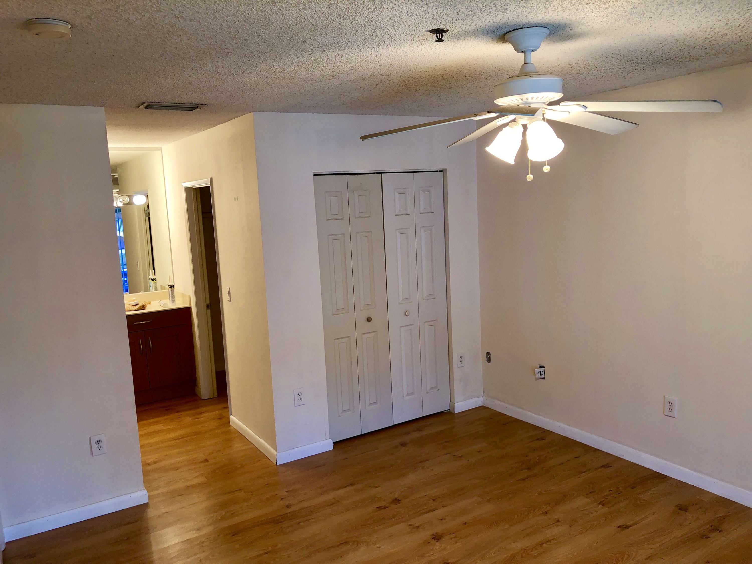 3133 Clint Moore Road, Unit 201 Boca Raton, FL 33496 - Photo 12 of 15 a view of empty room with wooden floor