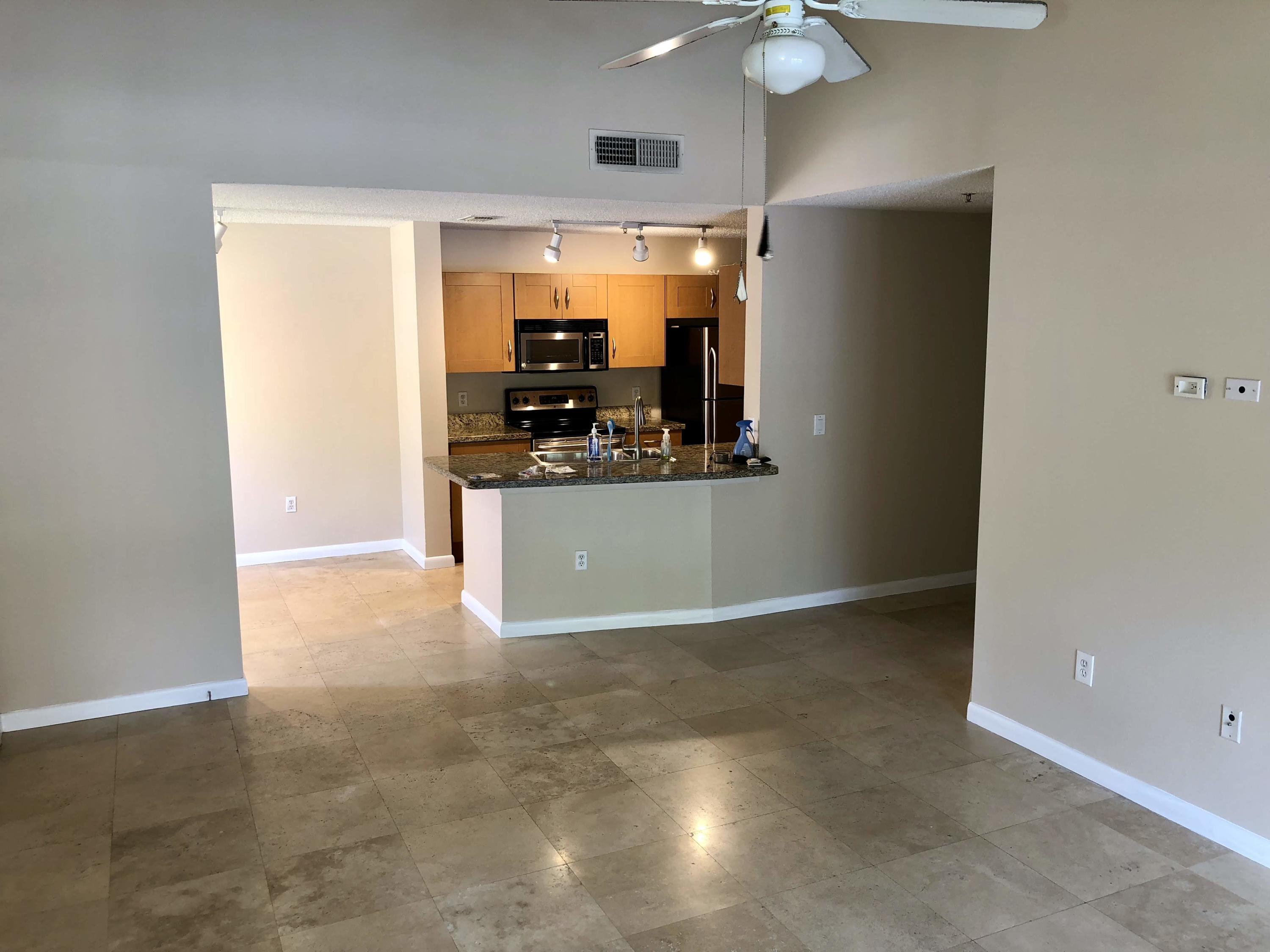 3133 Clint Moore Road, Unit 201 Boca Raton, FL 33496 - Photo 2 of 15 a view of a kitchen with a sink