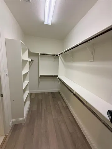 a view of an empty walk in closet