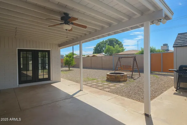 a view of a chairs and table in the patio