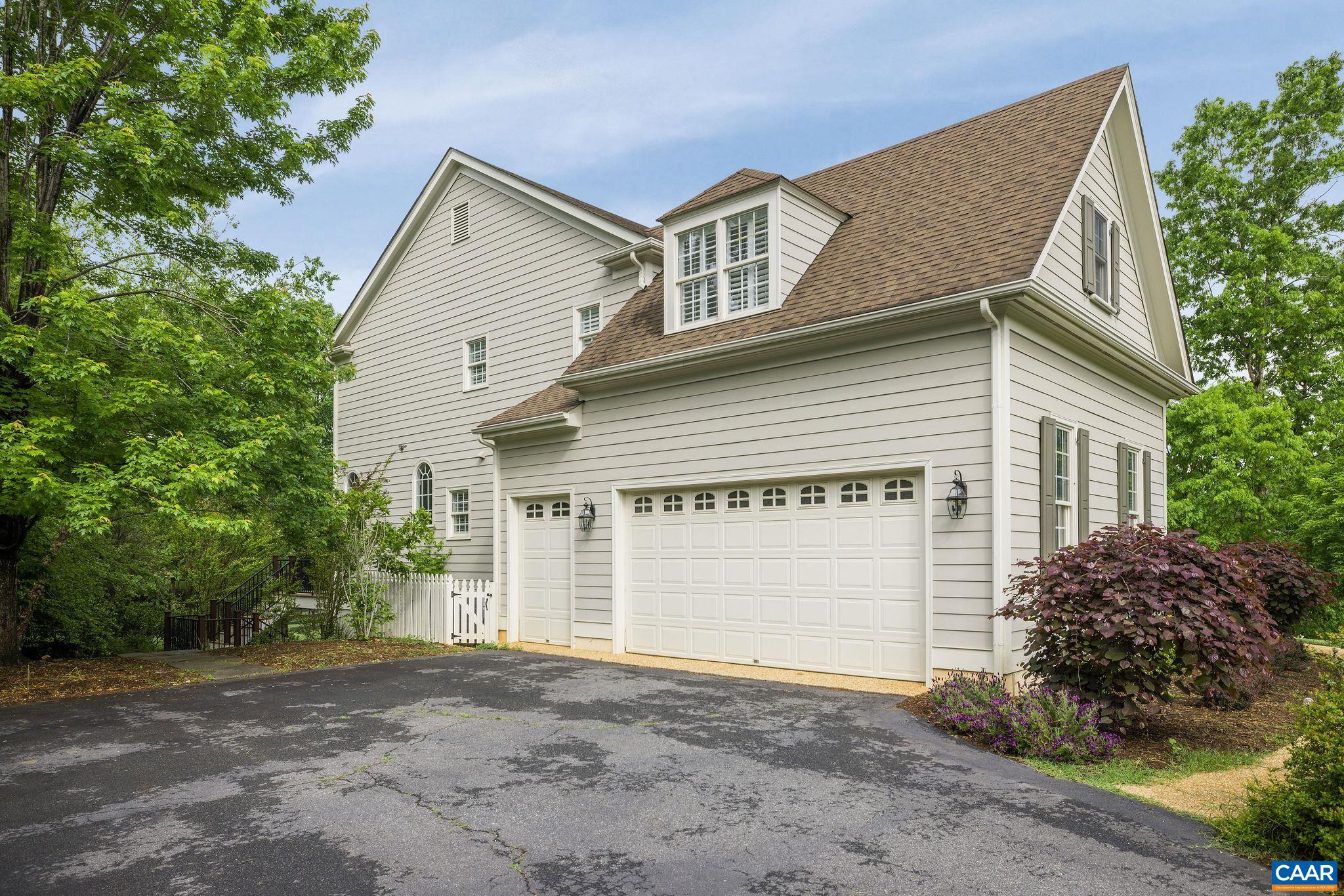3399 Darby Road Keswick, VA 22947 - Photo 55 of 73 a view of a house with a yard and garage