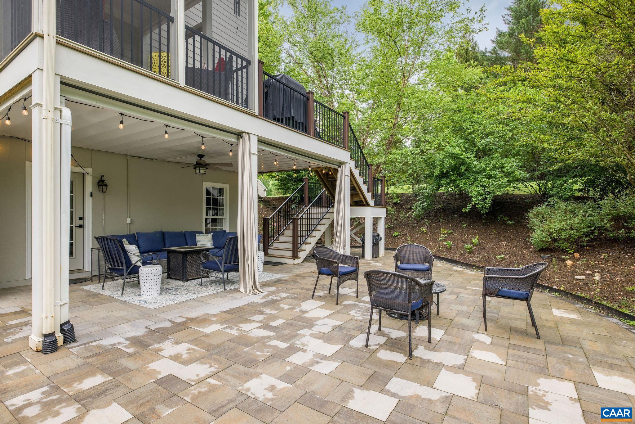 3399 Darby Road Keswick, VA 22947 - Photo 62 of 73 a backyard of a house with yard and outdoor seating