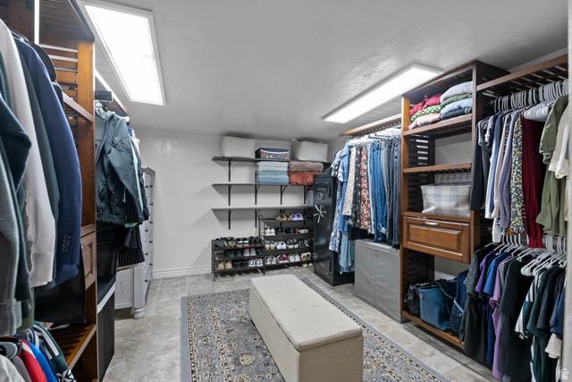 10686 South Covered Brg Cyn Road, Unit 14 Spanish Fork, UT 84660 - Photo 40 of 44 Custom closet system featuring dark wood-finish shelving and integrated hanging rods