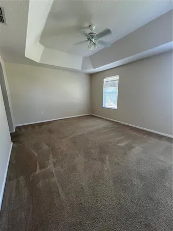 a spacious bathroom with a double vanity sink and a mirror
