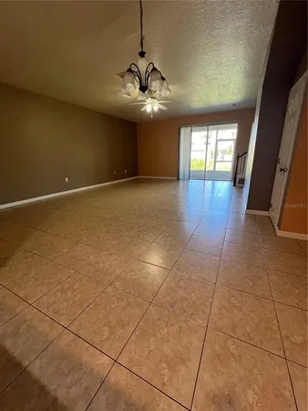 a view of an empty room with glass door