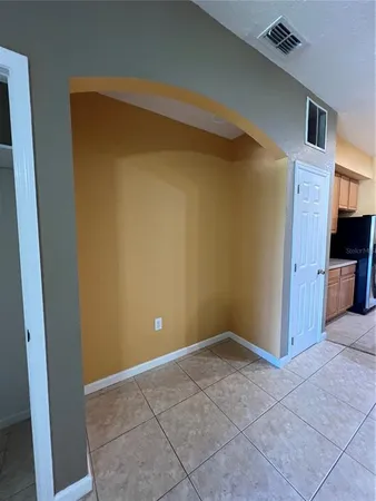 a kitchen with a stove and a window
