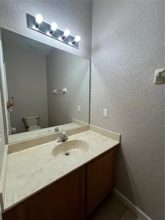 a bathroom with a sink double vanity and a mirror