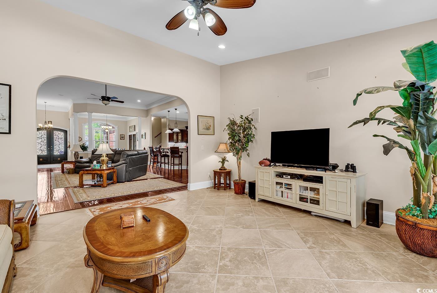 487 Trestle Way Conway, SC 29526 - Photo 14 of 40 Living area with ceiling fan, arched walkways, a chandelier, and recessed lighting