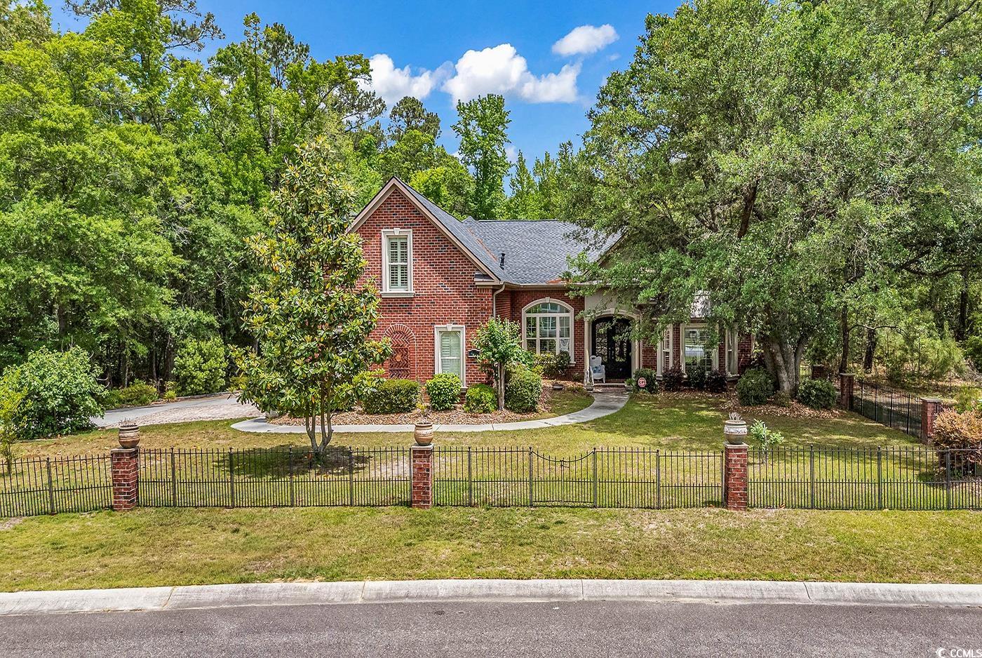 487 Trestle Way Conway, SC 29526 - Photo 2 of 40 View of front of house with brick siding and a fenced front yard