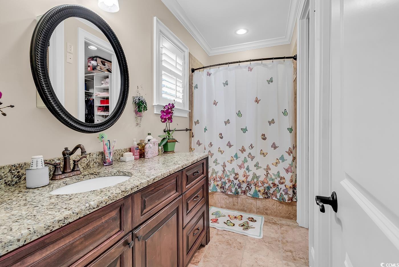 487 Trestle Way Conway, SC 29526 - Photo 23 of 40 Bathroom featuring vanity, crown molding, and a shower with shower curtain