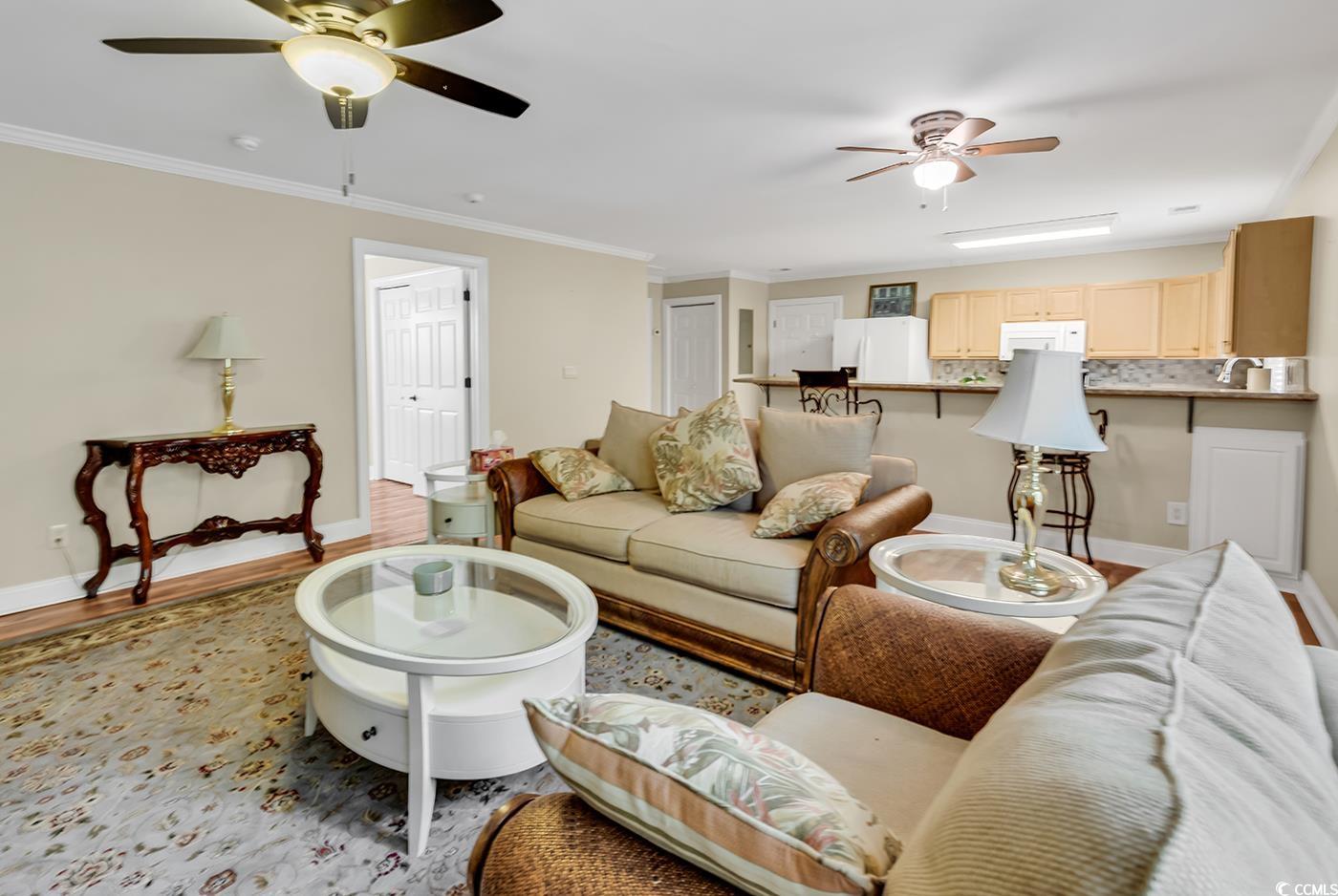 487 Trestle Way Conway, SC 29526 - Photo 28 of 40 Living room with a ceiling fan, ornamental molding, and wood finished floors