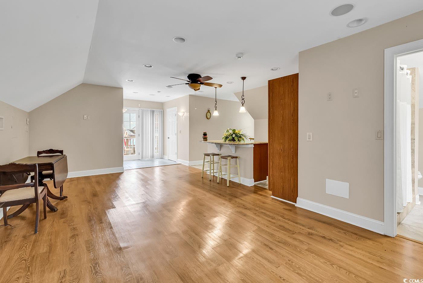 487 Trestle Way Conway, SC 29526 - Photo 29 of 40 Living room featuring a ceiling fan, light wood-style flooring, and vaulted ceiling