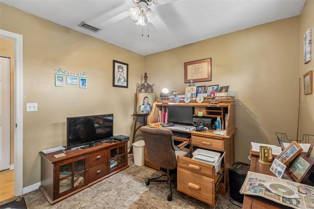 119 Burns Road Terra Ceia, FL 34250 - Photo 59 of 100 a room with furniture and a flat screen tv