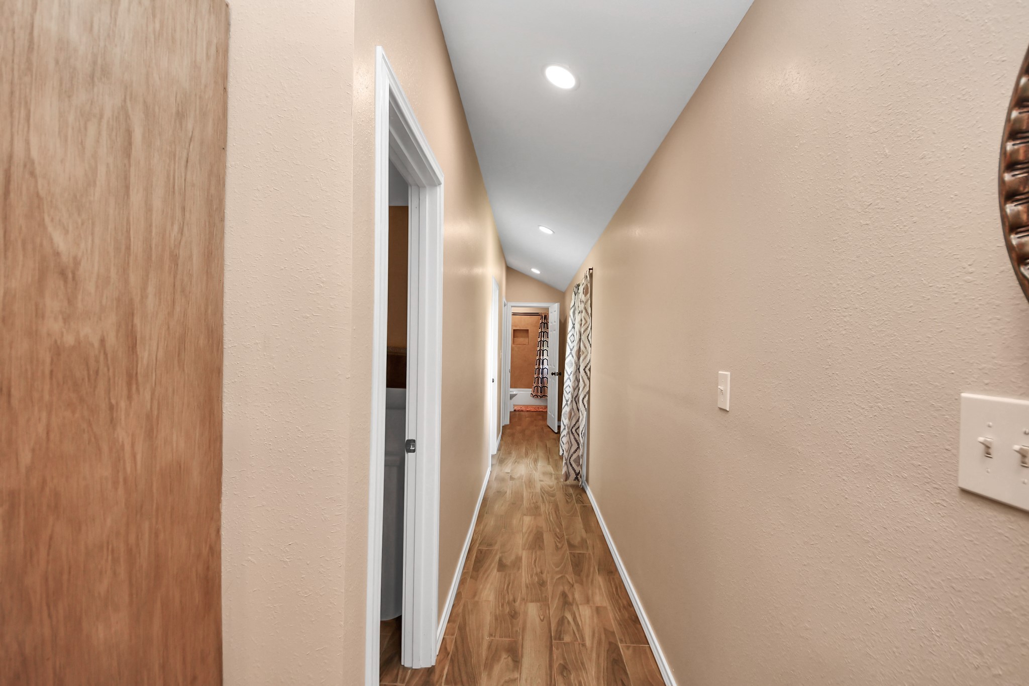 14961 Lamar Road Willis, TX 77378 - Photo 15 of 31 Functional layout with hallway leading to bedrooms and bathrooms areas and outdoor access.