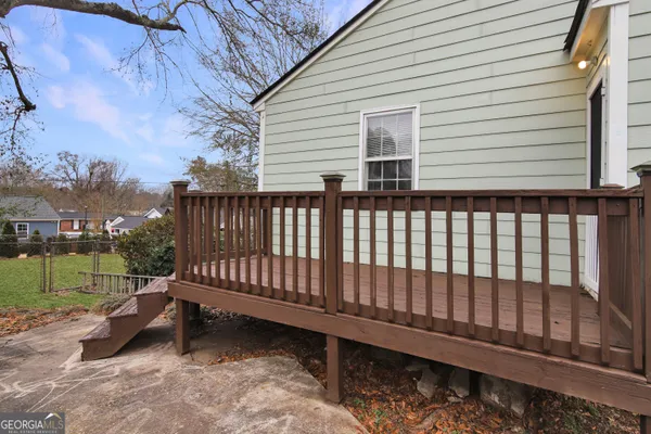 a view of a wooden bench in back yard