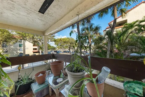 a view of a chairs and table in patio