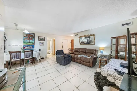 a living room with furniture rug and window