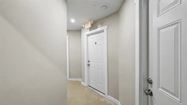 a bathroom with a double vanity sink and shower