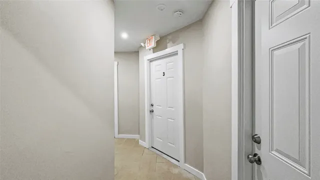 a bathroom with a double vanity sink and shower