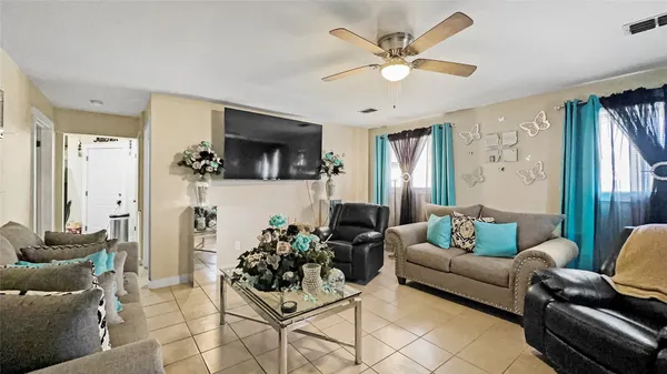 a living room with furniture and a flat screen tv