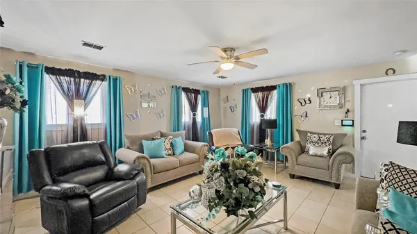 a living room with furniture and a large window