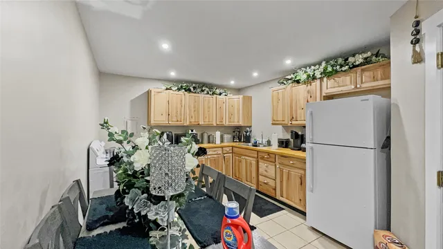 a kitchen with a refrigerator a stove and a microwave