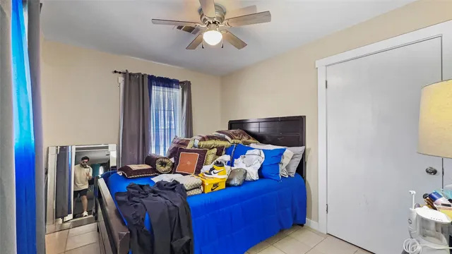 a bed room with a bed and a window