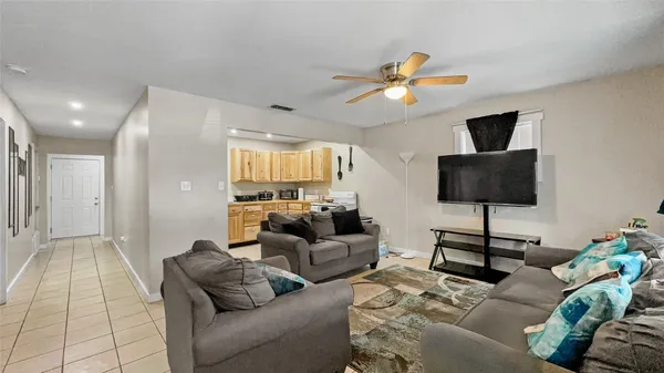 a living room with furniture and a flat screen tv
