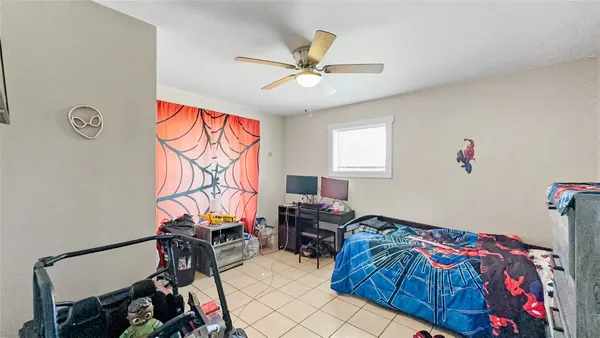 a bedroom with furniture and a window