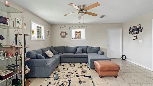 a living room with furniture and a rug