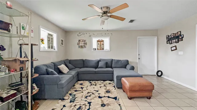 a living room with furniture and a rug
