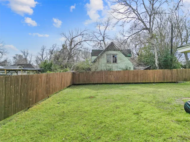 a backyard of a house with lots of green space