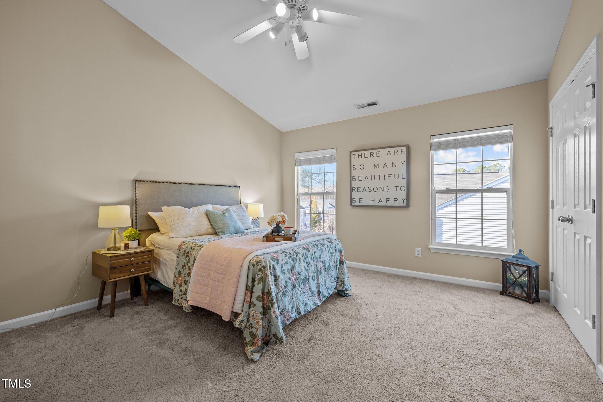 1674 Snow Mass Way Durham, NC 27713 - Photo 20 of 30 a spacious bedroom with a bed and a window