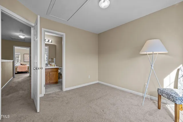 a view of a livingroom with furniture and an empty room