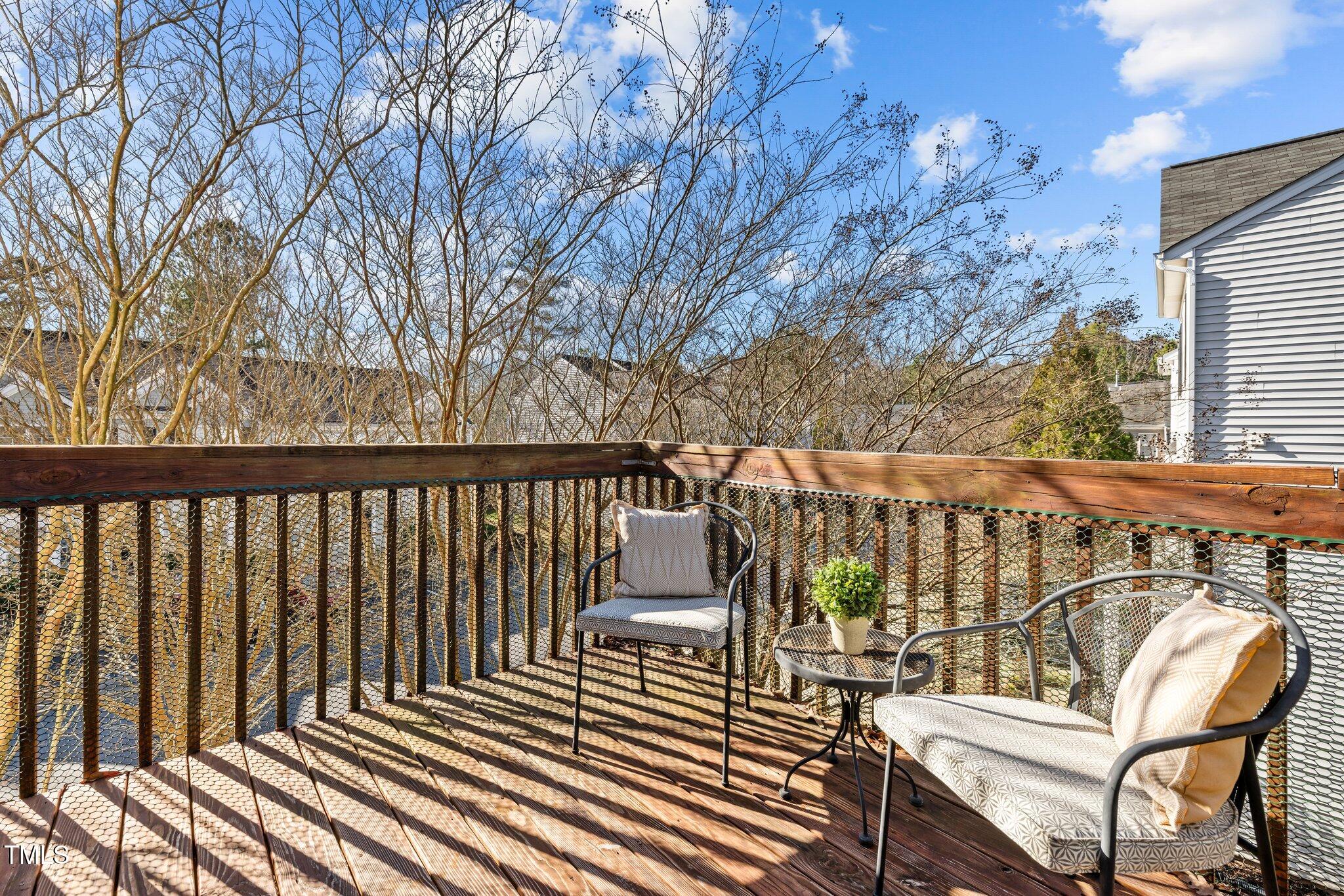 1674 Snow Mass Way Durham, NC 27713 - Photo 27 of 30 a balcony with wooden floor and outdoor seating
