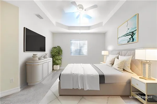 a bedroom with a bed window and potted plant