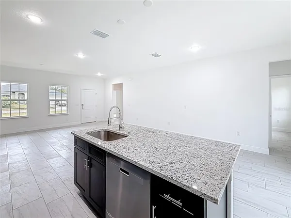 a kitchen that has a sink and a window