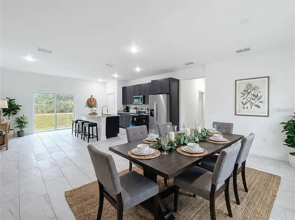 a view of a dining room with furniture