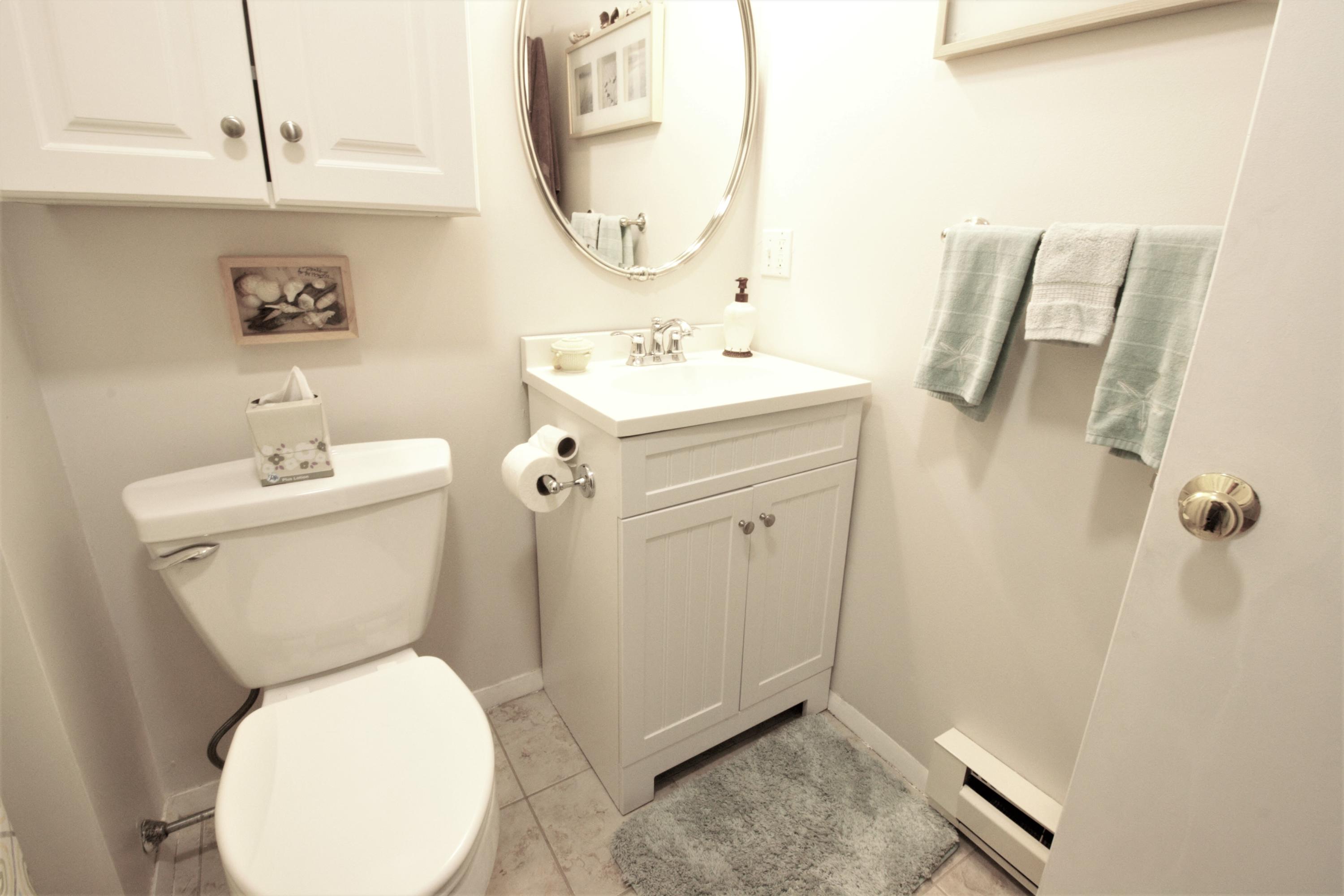 27 Round House Road Bourne, MA 02532 - Photo 11 of 13 a bathroom with a toilet sink and mirror
