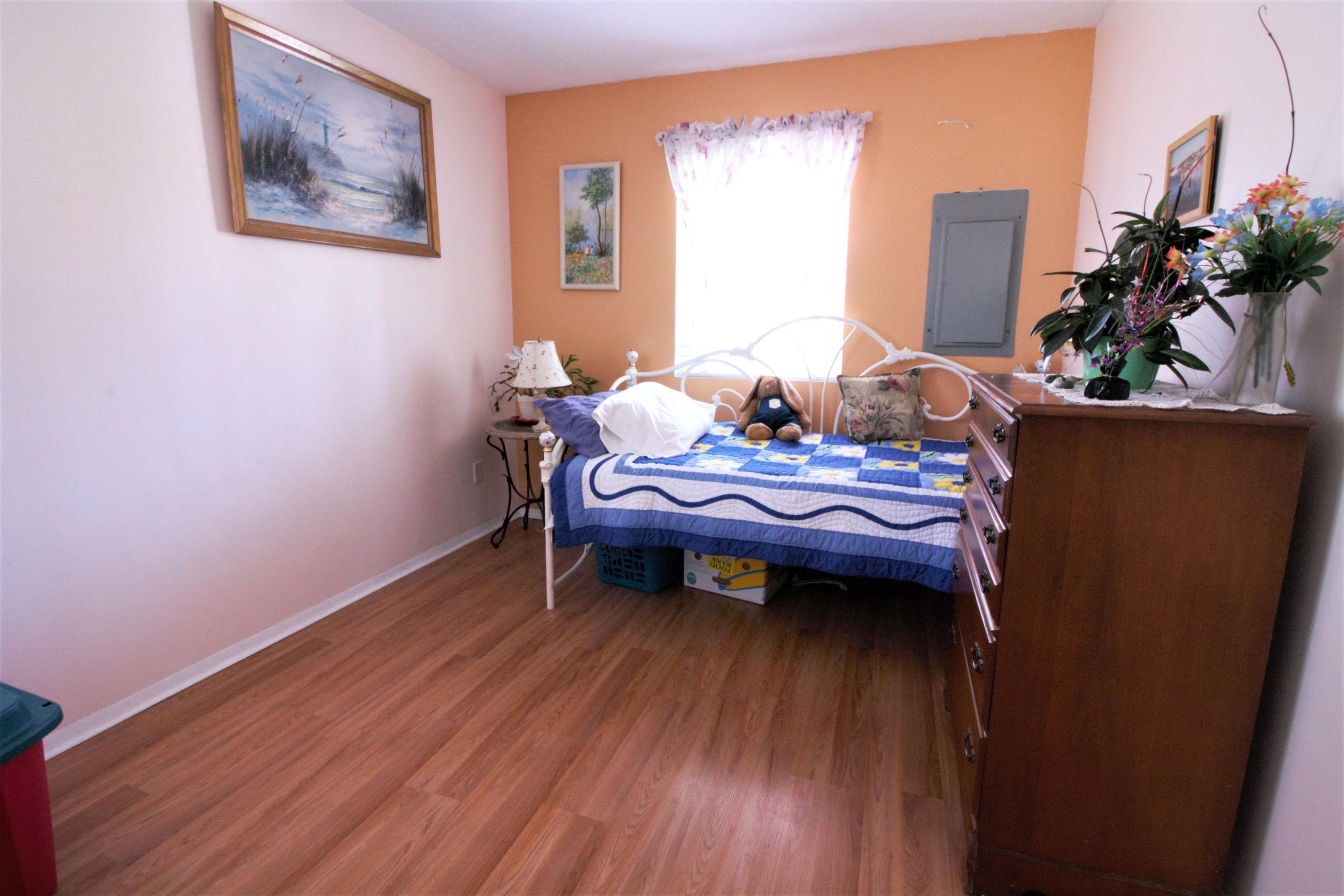 27 Round House Road Bourne, MA 02532 - Photo 9 of 13 a bed room with furniture and a wooden floor