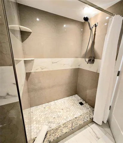 a bathroom with a sink and a shower