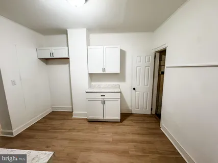 a kitchen with a refrigerator and a stove