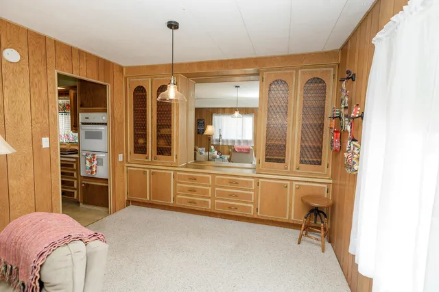 a kitchen with a sink a stove and a window