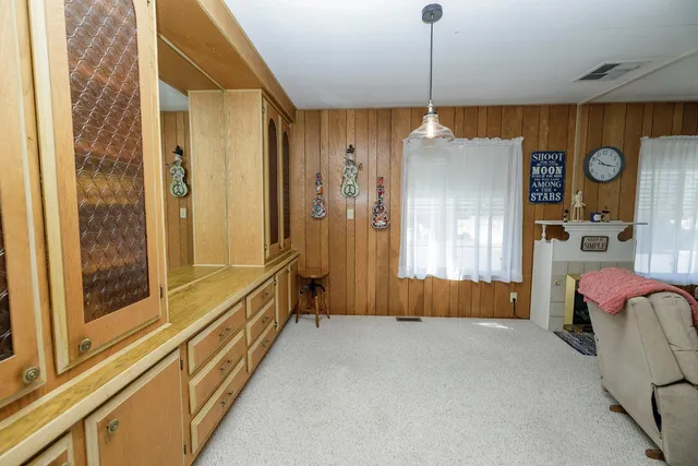 a kitchen that has a sink and a stove in it