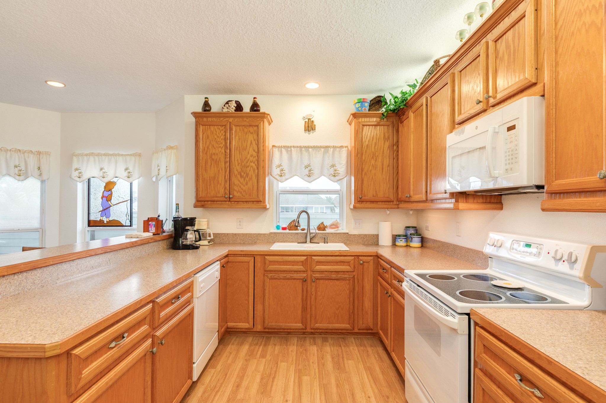 139 Driftwood Road Freeport, TX 77541 - Photo 20 of 34 a kitchen with a sink a stove and cabinets
