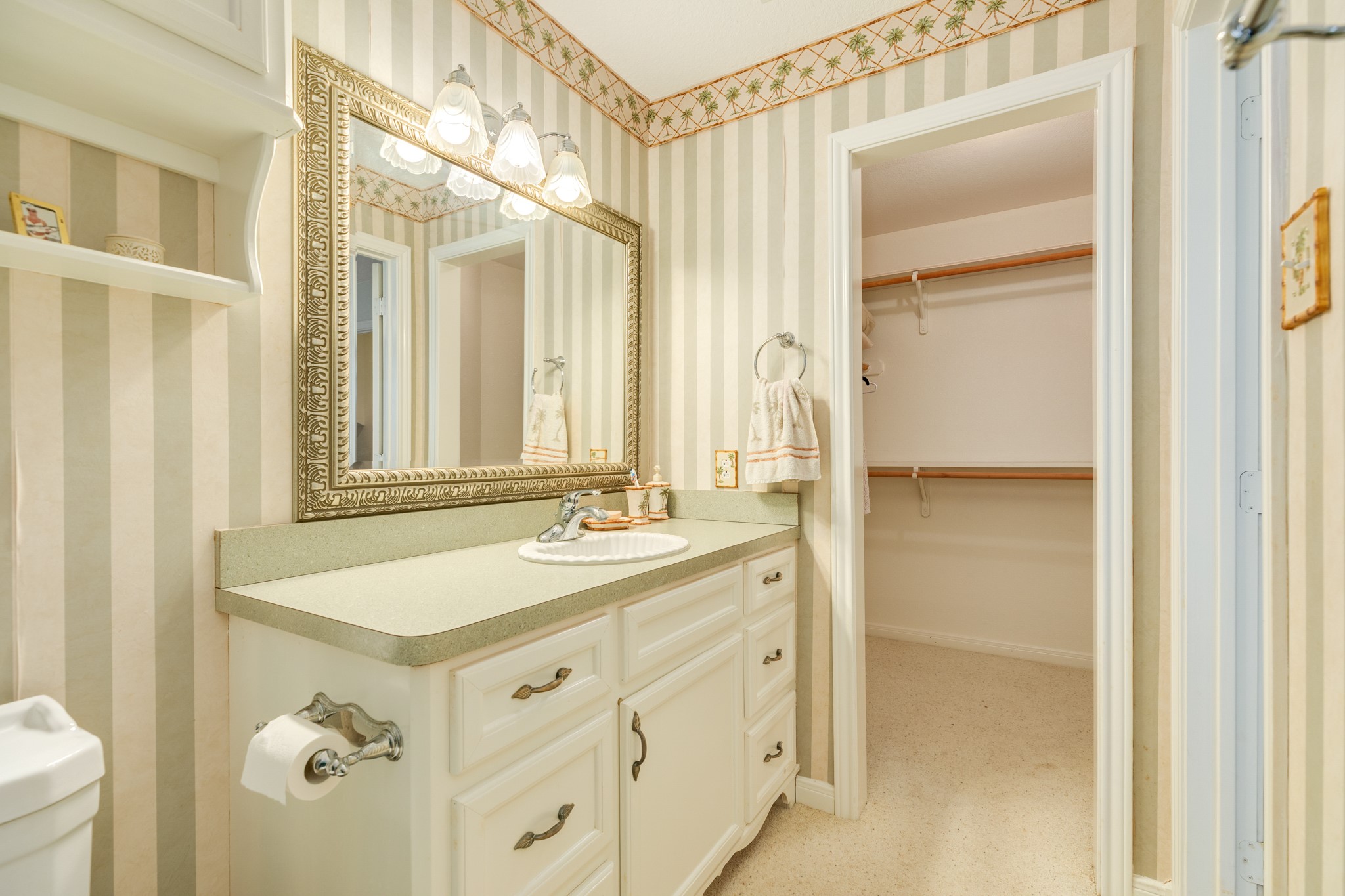139 Driftwood Road Freeport, TX 77541 - Photo 25 of 34 a bathroom with a sink and a mirror