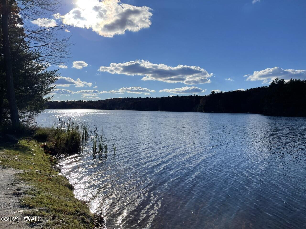 149 Walker Lake Road Shohola, PA 18458 - Photo 42 of 51 a view of a lake in middle of forest