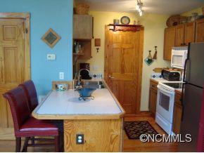 181 Caledonia Road Landrum, SC 29356 - Photo 12 of 24 a view of kitchen and dining room with furniture