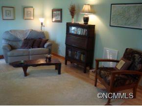 181 Caledonia Road Landrum, SC 29356 - Photo 13 of 24 a living room with furniture and a fireplace